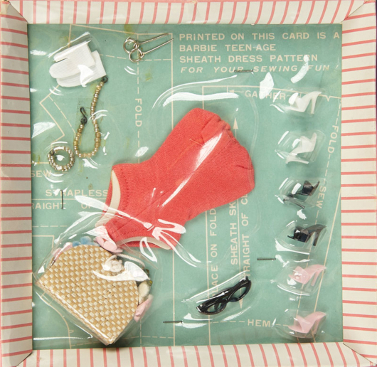 A boxed set containing a reddish Helenca swimsuit, a beaded necklace and bracelet, white gloves, black framed glasses, hoop earrings, a woven handbag, and open-toed heels in white, black and pale pink. The backing of the package can be seen to double as a sheath pattern; text visible says "Printed on this card is a Barbie teen-age sheath dress pattern *for your sewing fun!* Pattern pieces with folds and hems labeled are also visible, along with optional modifications to make the sheath strapless.