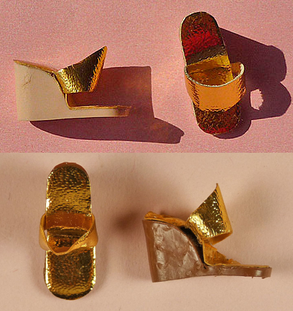 Two pairs of wedge heeled sandals with metallic gold uppers in a leather-like material. At top, the wedge portion of the shoe is made of tan plastic; at bottom, the wedge is made from a medium brown plastic.