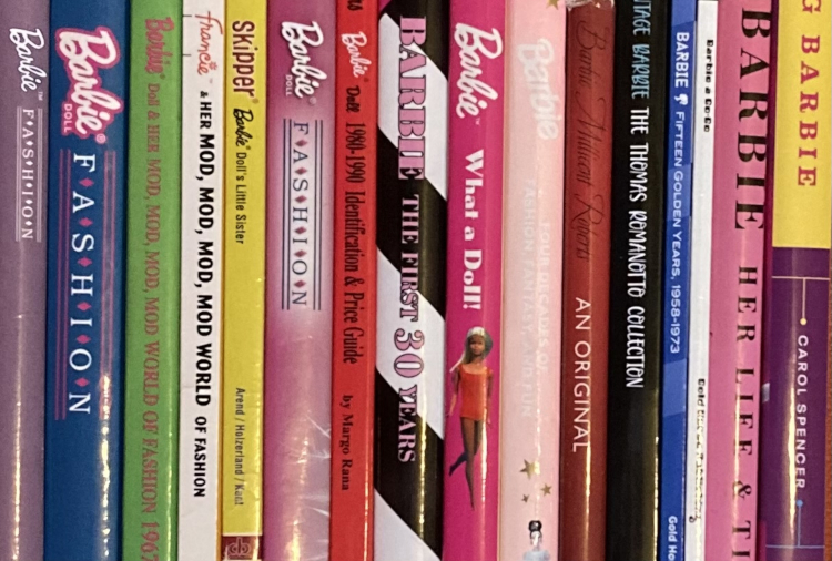 Close up on 16 book spines that all have "Barbie" in the title (save one that has "Francie" instead)