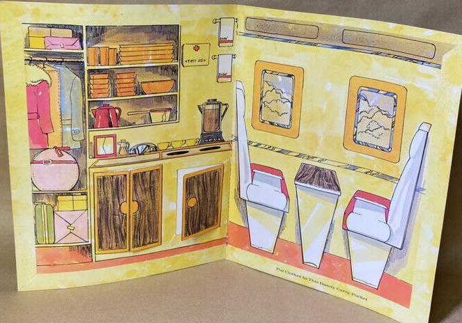 Folder stands open showing an airplane interior like the one in the Barbie Friend Ship play set. To one side is a closet with coats and small luggage. Next is a service area with dishes, sink, coffee pot, hanging towels, and cabinets the really open; to the right are drawn two rows of seats facing each other over a thin wood-look table. Windows beyond these show a cloudy sky. Below the sears is written "Put Clothes In This Handy Carry Pocket" (there is no pocket for the dolls this time).