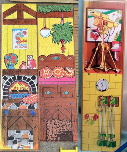 Two two walls described in the previous image are shown here removed form the structure. The living area and below deck area are made of two continuous pieces. A third, similar piece shows a TV camera pointed toward a skier on a slope outside a window. There's a set of headphones hanging from the camera, plus a monitor, implying a production booth. Downstairs is a clock and some weights on a yellow wall. One problem with this wall as part of the described structure is that the proportions of the upper and lower rooms are reversed: the living area of the actual play set has higher ceilings than the below stairs area, but in the third mysterious piece the production booth is shorter than the weight room below. 