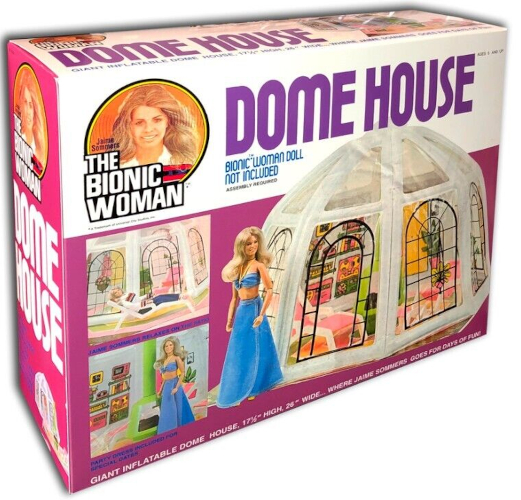 Box for The Bionic Eoman Dome House. Additional text reads, "Bionic Woman Doll Not Included; Assembly required; Giant inflatable dome house 17 1/2" high 26" wide - where Jaime Sommers goes for days of fun" In color photographs, A Bionic Woman doll is shown resting on a beach chair, standing next to a green free-standing fireplace, and standing outside the dome which is clear vinyl encircled by inflatable white supports. In the latter two images, the doll wears a blue halter-necked bra top and long matching wrap skirt. The beach shair and a basic chair glimped inside the dome are of white plastic with pink fabric stretched between supports to form the back and seat.