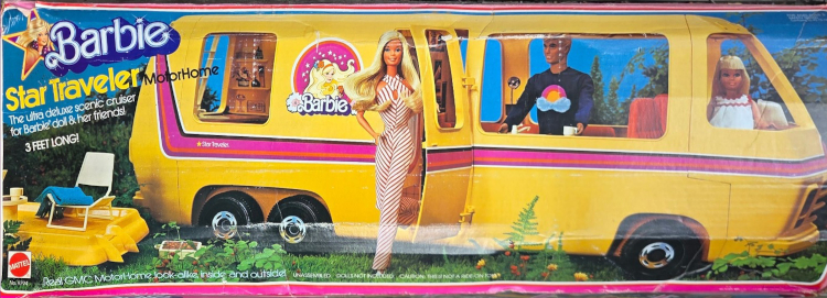 Color photograph box exterior for a vehicle that is longer than the bus and camper. It is yellow with a pink stripe going down its length and a Barbie logo with a Superstar-look Barbie illustrated. Superstar Barbie stands next to an open door of the vehicle, while Ken and Skipper inside look out the windows. Box text says "Barbie Star Traveler MotorHome, the ultra-deluxe scenic cruiser for Barbie doll & her friends! 3 FEET LONG!"