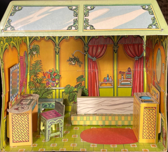 Chipboard room photograph. The walls are golden yellow with green columns that spread like palm trees at the top. To one side hang red curtains (illustrated on the wall) drawn back to revewl shelves of bottles, flowers, and cloths. There are some potted plants hanging on another section of wall and illustated standing along the base of the wall, and mirror illustrated on one side. The trapezoidal top of the structure is printed with skylight panels, "glass' indicated by white streaks on pale blue, in ornate green frames. In the room are pieces of chipboard furniture listed in the text. The "tub" is actually just a chipboard corner to attach to the corner of the room to form the shape. It's composed of a higher wall in marble look outlined by a lower wall in green and yellow tile look.